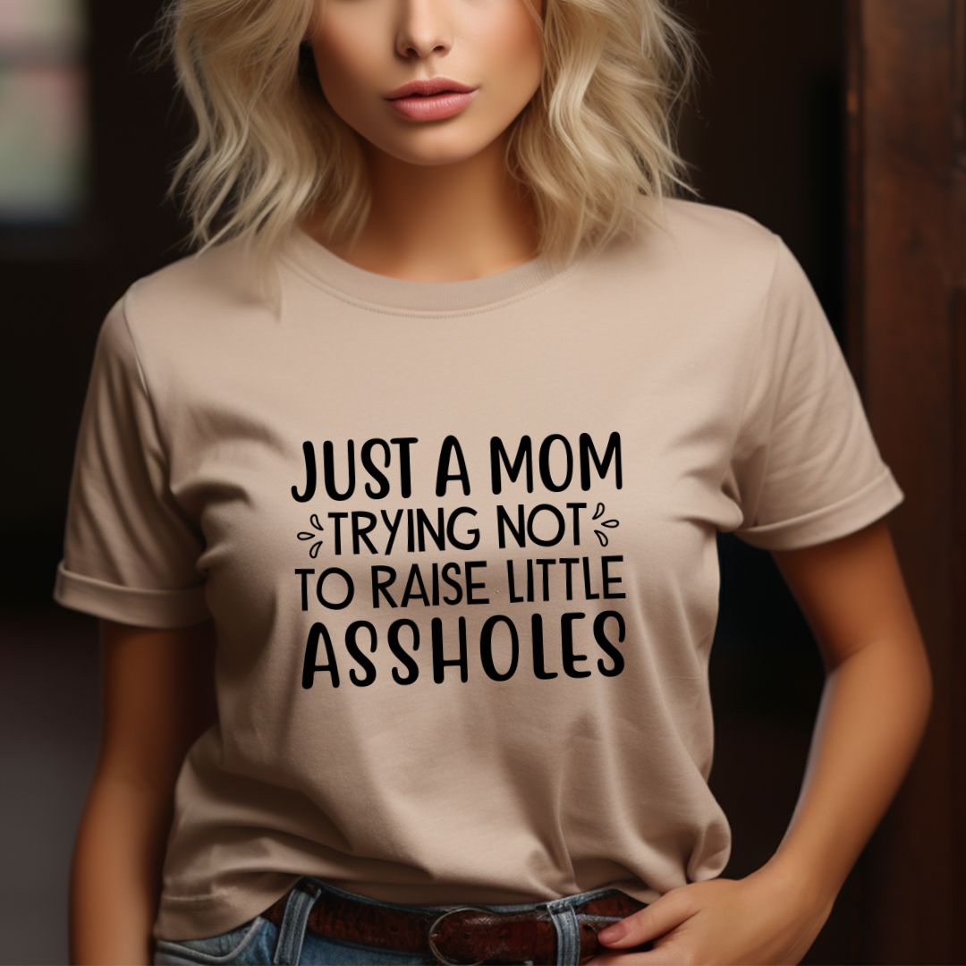 Just a MOM trying not to raise Littel A-holes tee